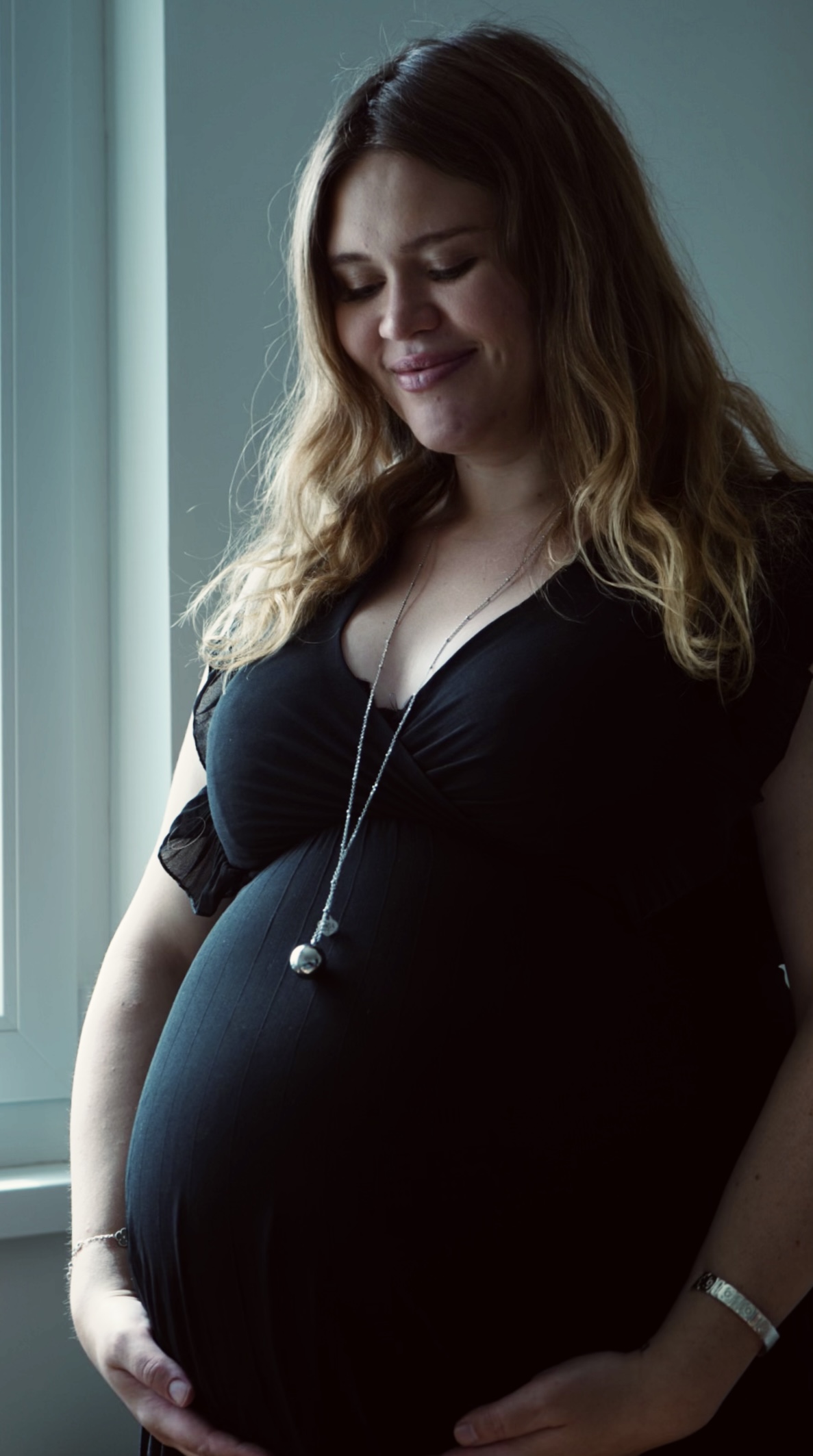 Portrait of an expectant mother at a baby shower